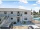 Exterior view of building offering balconies and pool access with parking at 3620 Cardinal Blvd # 80, Daytona Beach, FL 32118