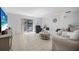 Bright living room features tile flooring, neutral colors, sliding doors, and comfortable seating at 3620 Cardinal Blvd # 80, Daytona Beach, FL 32118