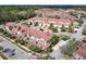 Townhome aerial view highlighting the property's layout in a community with manicured lawns and trees at 3620 Tresto St, New Smyrna Beach, FL 32168