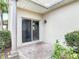 Cozy back patio with brick pavers and a sliding door at 3620 Tresto St, New Smyrna Beach, FL 32168