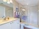 This bathroom has neutral colors and a large glass shower at 3620 Tresto St, New Smyrna Beach, FL 32168