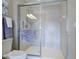 This bathroom's spacious glass shower has a built in seat at 3620 Tresto St, New Smyrna Beach, FL 32168