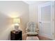 A bonus room features a comfortable chair and a reading lamp at 3620 Tresto St, New Smyrna Beach, FL 32168