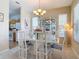 Bright dining area adjacent to kitchen, featuring a modern table set and natural light at 3620 Tresto St, New Smyrna Beach, FL 32168