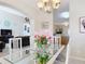 Inviting dining area flows into living room and kitchen, features modern decor and ample light at 3620 Tresto St, New Smyrna Beach, FL 32168