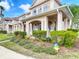 Inviting townhome with manicured landscaping and a covered porch, perfect for enjoying the outdoors at 3620 Tresto St, New Smyrna Beach, FL 32168