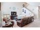 Spacious living room with high ceilings, comfortable seating, and stylish decor including a piano at 3620 Tresto St, New Smyrna Beach, FL 32168