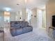Spacious living room with comfortable seating, neutral carpet, and abundant natural light at 3620 Tresto St, New Smyrna Beach, FL 32168