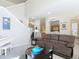 Comfortable living room showcasing a brown reclining sofa and a white piano at 3620 Tresto St, New Smyrna Beach, FL 32168