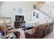 Inviting living room with high ceilings, comfortable sofas, and stylish decor, well lit by lamps at 3620 Tresto St, New Smyrna Beach, FL 32168