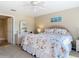 Cozy main bedroom with a vanity, natural light, neutral carpet and a full ensuite bathroom at 3620 Tresto St, New Smyrna Beach, FL 32168
