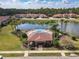 Community pool with seating and lake views at 3620 Tresto St, New Smyrna Beach, FL 32168
