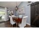 Dining room with a wooden table, stylish chairs, and a sliding barn door at 464 Nash Ln, Port Orange, FL 32127