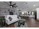 Modern living area with open layout to the kitchen, stylish seating, wood floors, and contemporary decor at 464 Nash Ln, Port Orange, FL 32127