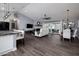 Bright open living room and dining area with wood-look floors and contemporary furnishings, plus a view of the patio at 464 Nash Ln, Port Orange, FL 32127