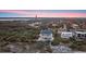 Expansive aerial view of beautiful home in a lush setting complete with a private pool and manicured grounds at 4911 S Atlantic Ave, Ponce Inlet, FL 32127