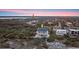 Expansive aerial view of beautiful home in a lush setting complete with a private pool and manicured grounds at 4911 S Atlantic Ave, Ponce Inlet, FL 32127