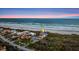 Breathtaking aerial view showcases a luxurious oceanfront home with lush landscaping and private beach access at 4911 S Atlantic Ave, Ponce Inlet, FL 32127