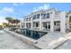 Beautiful backyard featuring a sleek pool and spacious patio of a modern, multi-story home at 4911 S Atlantic Ave, Ponce Inlet, FL 32127