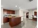 The bar area has a sink, under-cabinet storage and views of the main kitchen at 4911 S Atlantic Ave, Ponce Inlet, FL 32127