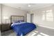 Cozy bedroom featuring a plush blue comforter and a spacious, inviting atmosphere at 4911 S Atlantic Ave, Ponce Inlet, FL 32127