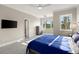 Bedroom with bright natural light, ceiling fan, and contemporary decor at 4911 S Atlantic Ave, Ponce Inlet, FL 32127
