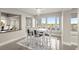 This dining room offers natural light and ocean views for elegant meals at 4911 S Atlantic Ave, Ponce Inlet, FL 32127