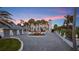 Stunning home features a grand entrance, lush landscaping, and a spacious three-car garage, perfect for luxury living at 4911 S Atlantic Ave, Ponce Inlet, FL 32127