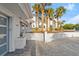 Stunning home exterior featuring a paver driveway, manicured landscaping, and well maintained white exterior at 4911 S Atlantic Ave, Ponce Inlet, FL 32127
