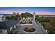 Aerial view of a large home with circular driveway, fountain, and lush landscaping at 4911 S Atlantic Ave, Ponce Inlet, FL 32127