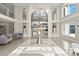 Expansive foyer with high ceilings, grand staircase, and elegant decor elements at 4911 S Atlantic Ave, Ponce Inlet, FL 32127