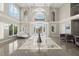 Bright and spacious foyer with high ceilings and luxurious finishes with marble flooring at 4911 S Atlantic Ave, Ponce Inlet, FL 32127