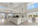 A sun-soaked living room offers a fireplace and open floor plan at 4911 S Atlantic Ave, Ponce Inlet, FL 32127