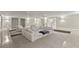 Spacious living room with sunken seating area, modern decor, and bright, airy ambiance at 4911 S Atlantic Ave, Ponce Inlet, FL 32127