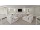 Spacious living room featuring cozy furniture and great natural lighting at 4911 S Atlantic Ave, Ponce Inlet, FL 32127