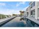 Exterior view of a pool and patio with lounge chairs, overlooking the ocean at 4911 S Atlantic Ave, Ponce Inlet, FL 32127