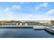 A beautiful pool with ocean view and lounge chairs with sunny skies at 4911 S Atlantic Ave, Ponce Inlet, FL 32127