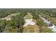 Aerial view of the golf course community shows the layout of the neighborhood and surrounding natural landscape at 509 Victoria Hills Dr, Deland, FL 32724
