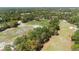 Expansive aerial view showcases the proximity to a golf course at 509 Victoria Hills Dr, Deland, FL 32724
