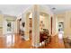 Stylish bar area with granite countertops, seating, and decorative archways for an elegant touch at 509 Victoria Hills Dr, Deland, FL 32724