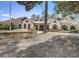 Exterior view of the clubhouse with stone accents, red shutters, and well-maintained landscaping at 509 Victoria Hills Dr, Deland, FL 32724