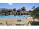 Community pool featuring an entrance ramp and a building with restrooms and changing rooms at 509 Victoria Hills Dr, Deland, FL 32724