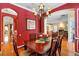 Open dining room with chandelier, wooden table, and adjacent living spaces visible at 509 Victoria Hills Dr, Deland, FL 32724
