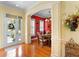 Dining room features a wood floor, elegant chandelier and an archway to other rooms at 509 Victoria Hills Dr, Deland, FL 32724