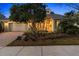 Charming home featuring a well-maintained front yard, manicured landscaping, and a welcoming red front door at 509 Victoria Hills Dr, Deland, FL 32724