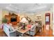 Spacious living room features hardwood floors, comfortable sofas, and a large entertainment center at 509 Victoria Hills Dr, Deland, FL 32724