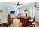 Bright office space features a ceiling fan, hardwood floors, and decorative nautical accents for a relaxed atmosphere at 509 Victoria Hills Dr, Deland, FL 32724