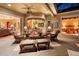 Covered outdoor living space features comfortable seating and views of the dining room and main bedroom at 509 Victoria Hills Dr, Deland, FL 32724