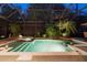 Backyard enclosed pool and hot tub area with a screened enclosure and tropical plants offers privacy and relaxation at 509 Victoria Hills Dr, Deland, FL 32724