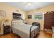 Bedroom with hardwood floors, natural light, and a ceiling fan at 514 Land O Lakes Ct, Deland, FL 32724